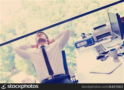 happy young business man work in modern office on computer