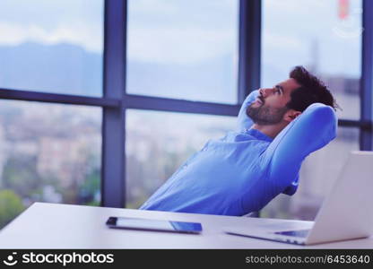 happy young business man work in modern office on computer