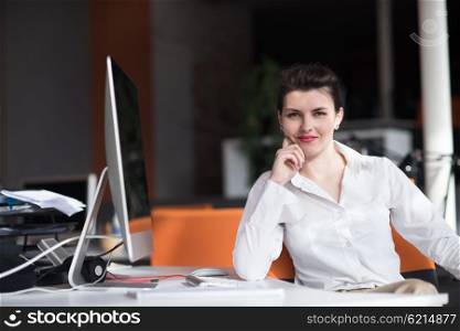 happy young business woman relaxing and geting insiration while working on desktop computer at modern bright starup office interior