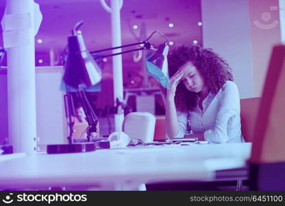 happy young business woman with curly hairstyle in the modern office