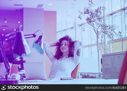 happy young business woman with curly hairstyle in the modern office