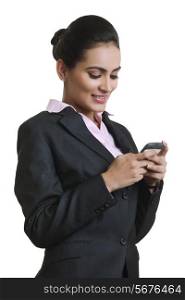 Happy young businesswoman using mobile phone isolated over white background
