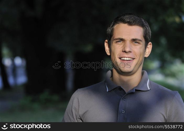 happy young casual man outdoor portrait smiling