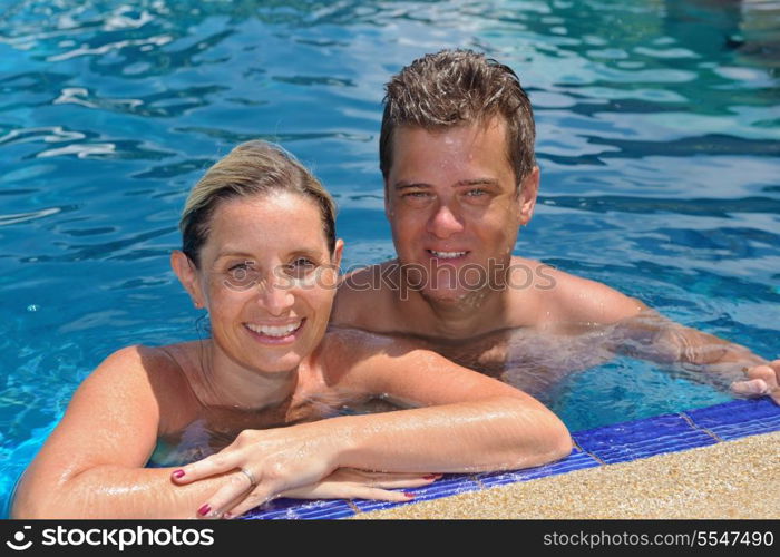 happy young couple at summer vacation have fun and relax at beautiful sunny day on beach