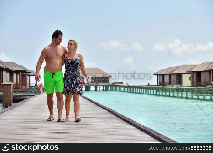 happy young couple at summer vacation have fun and relax at beautiful sunny day on beach