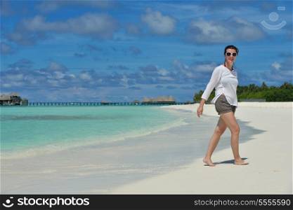 happy young couple at summer vacation have fun and relax at beautiful sunny day on beach