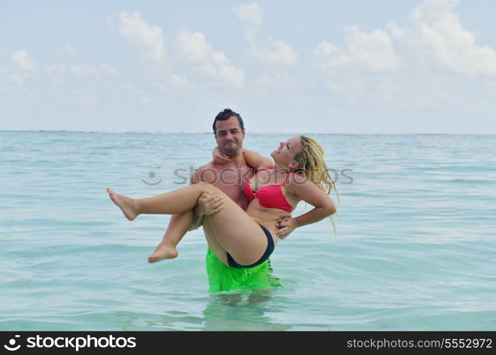 happy young couple at summer vacation have fun and relax at beautiful sunny day