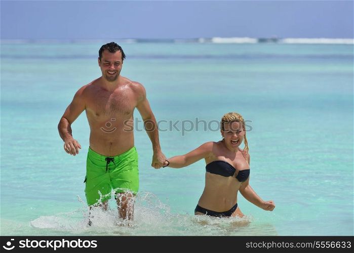 happy young couple at summer vacation have fun and relax at beautiful sunny day