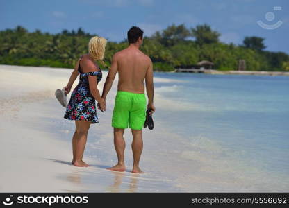 happy young couple at summer vacation have fun and relax at beautiful sunny day