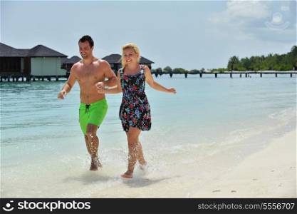happy young couple at summer vacation have fun and relax at beautiful sunny day