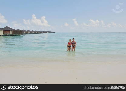 happy young couple at summer vacation have fun and relax at beautiful sunny day