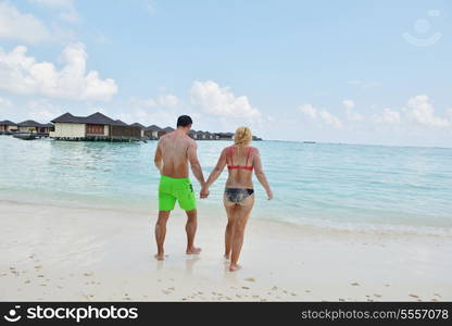 happy young couple at summer vacation have fun and relax at beautiful sunny day