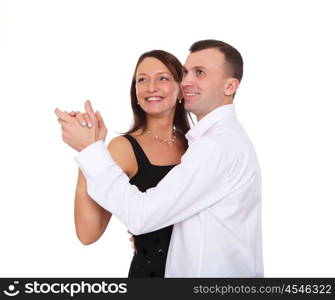 happy young couple dancing together in studio