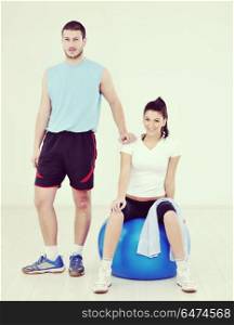 happy young couple fitness workout and fun at sport gym club. happy young couple fitness workout and fun