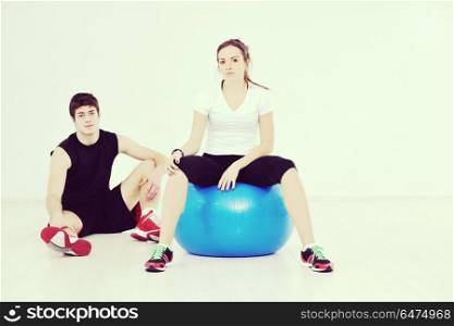 happy young couple fitness workout and fun at sport gym club. happy young couple fitness workout and fun