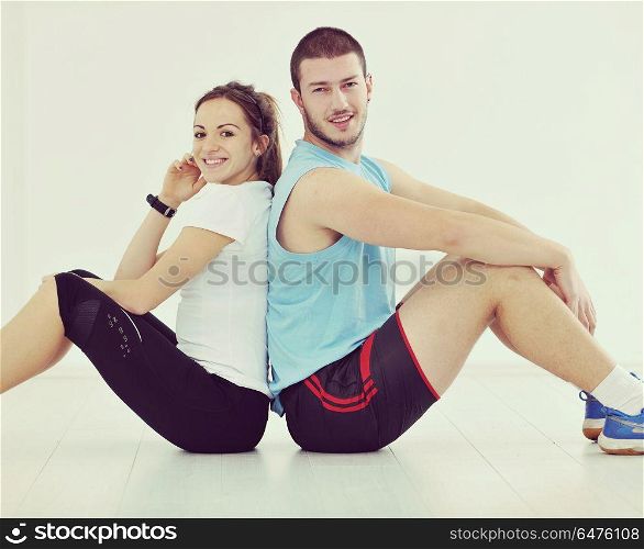 happy young couple fitness workout and fun at sport gym club . happy young couple fitness workout and fun