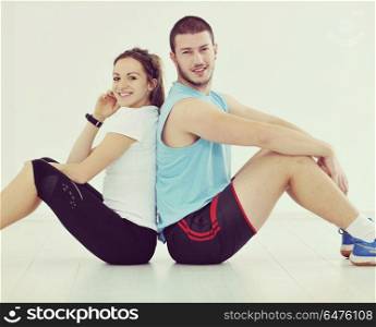 happy young couple fitness workout and fun at sport gym club . happy young couple fitness workout and fun