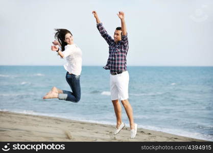 happy young couple have fun and romantic moments on beach at summer season and representing happynes and travel concept