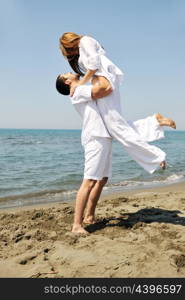 happy young couple have fun and romantic moments on beach at summer season and representing happynes and travel concept