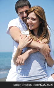 happy young couple have fun and romantic moments on beach at summer season and representing happynes and travel concept