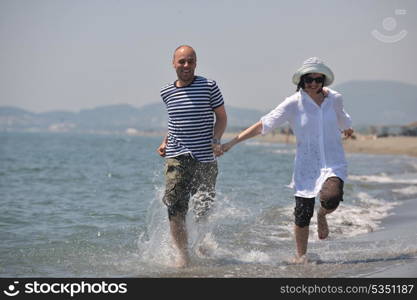 happy young couple have fun and romantic moments on beach at summer season and representing happynes and travel concept