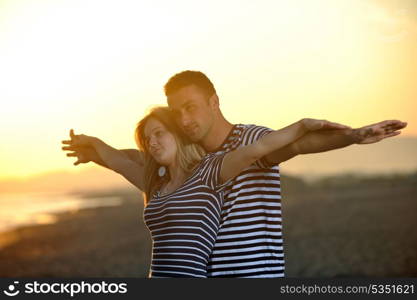 happy young couple have fun and romantic moments on beach at summer season and representing happynes and travel concept