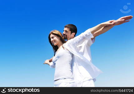 happy young couple have fun and romantic moments on beach at summer season and representing happynes and travel concept