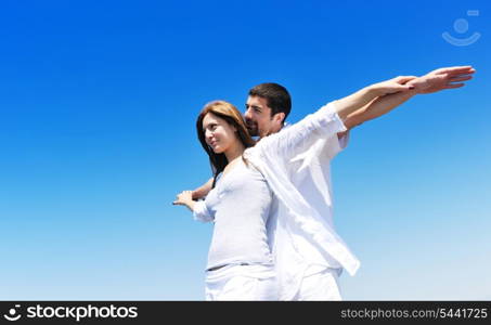 happy young couple have fun and romantic moments on beach at summer season and representing happynes and travel concept