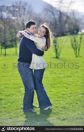 happy young couple have good time and fun outdoor at beautiful sunny day
