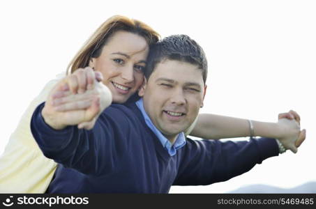 happy young couple have good time and fun outdoor at beautiful sunny day