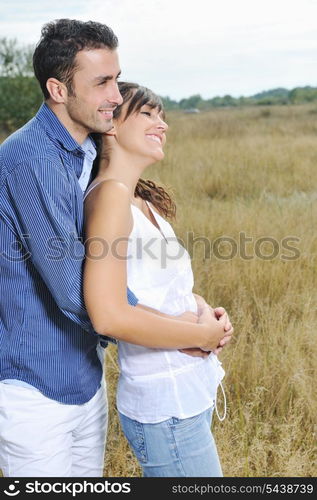 happy young couple have romantic time outdoor while smiling and hug