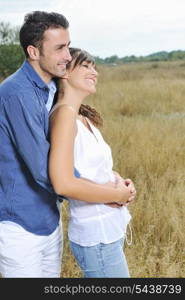 happy young couple have romantic time outdoor while smiling and hug