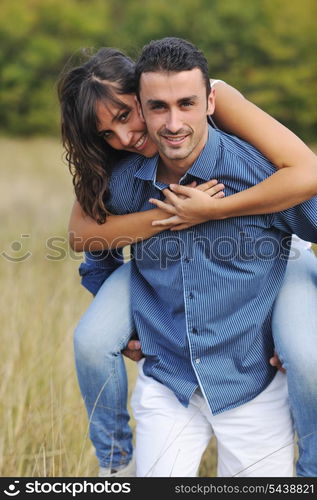 happy young couple have romantic time outdoor while smiling and hug