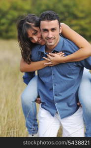 happy young couple have romantic time outdoor while smiling and hug