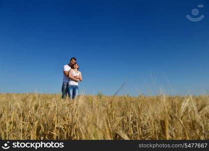 happy young couple in love have romance and fun at wheat field in summer