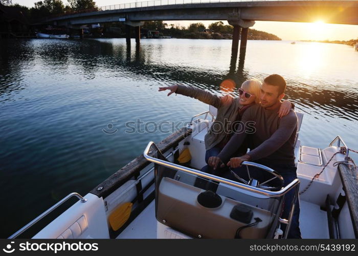 happy young couple in love have romantic time at summer sunset at ship boat while representing urban and countryside fashin lifestyle