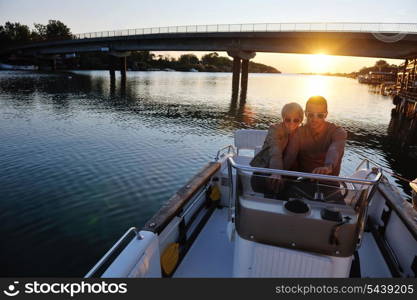 happy young couple in love have romantic time at summer sunset at ship boat while representing urban and countryside fashin lifestyle