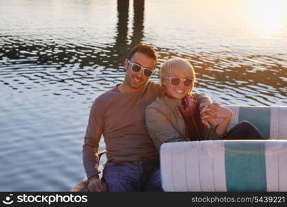 happy young couple in love have romantic time at summer sunset at ship boat while representing urban and countryside fashin lifestyle