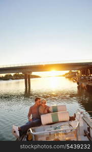 happy young couple in love have romantic time at summer sunset at ship boat while representing urban and countryside fashin lifestyle