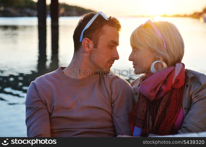 happy young couple in love have romantic time at summer sunset at ship boat while representing urban and countryside fashin lifestyle