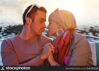 happy young couple in love have romantic time at summer sunset at ship boat while representing urban and countryside fashin lifestyle