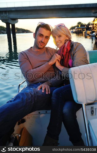 happy young couple in love have romantic time at summer sunset at ship boat while representing urban and countryside fashin lifestyle