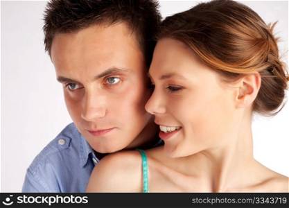 Happy young couple in love portrait isolated over a white background