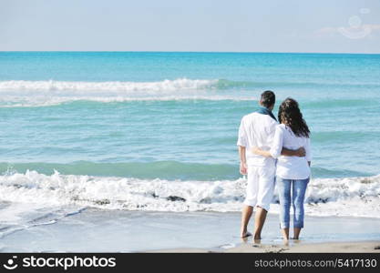 happy young couple in white clothing have romantic recreation and fun at beautiful beach on vacations