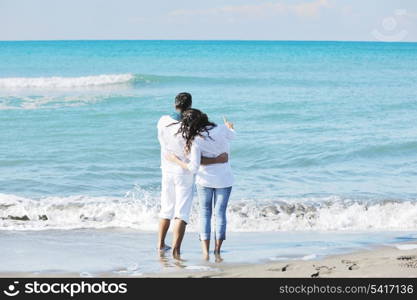 happy young couple in white clothing have romantic recreation and fun at beautiful beach on vacations