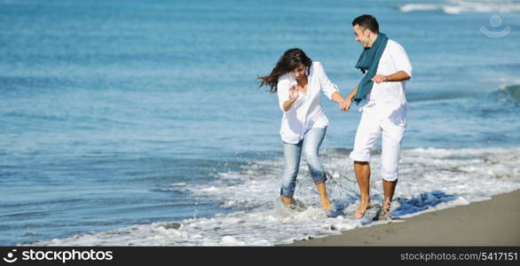 happy young couple in white clothing have romantic recreation and fun at beautiful beach on vacations