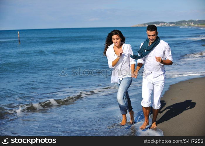 happy young couple in white clothing have romantic recreation and fun at beautiful beach on vacations