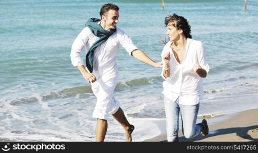 happy young couple in white clothing have romantic recreation and fun at beautiful beach on vacations