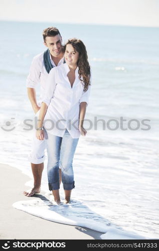 happy young couple in white clothing have romantic recreation and fun at beautiful beach on vacations