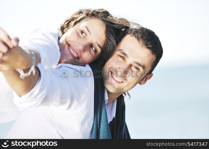 happy young couple in white clothing have romantic recreation and fun at beautiful beach on vacations